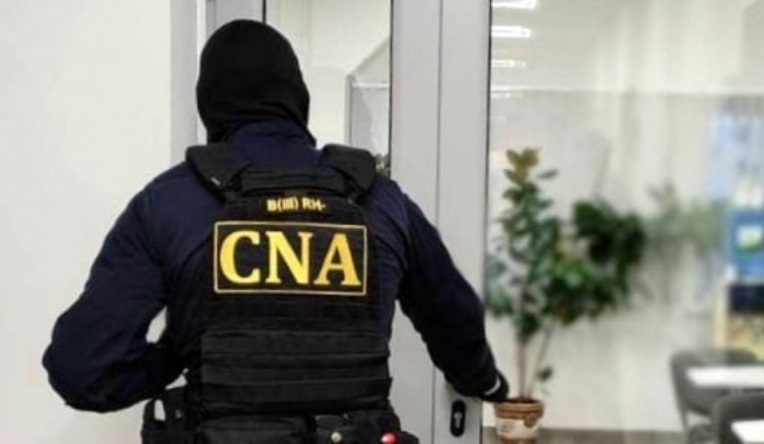 Secretar de stat, reținut de CNA